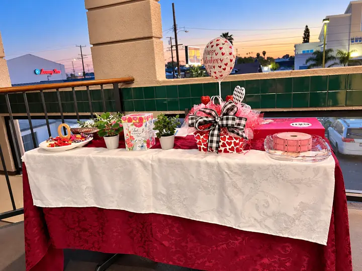 Decorated welcome, cake and gift table inside the fellowship hall