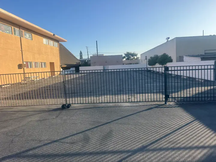 Side gate looking into the rear parking area of the church campus