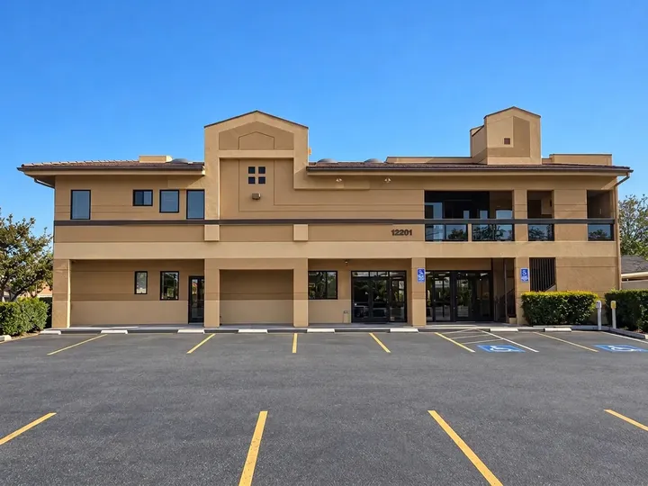 Two-story Norwalk Events Center building with its parking lot in front
