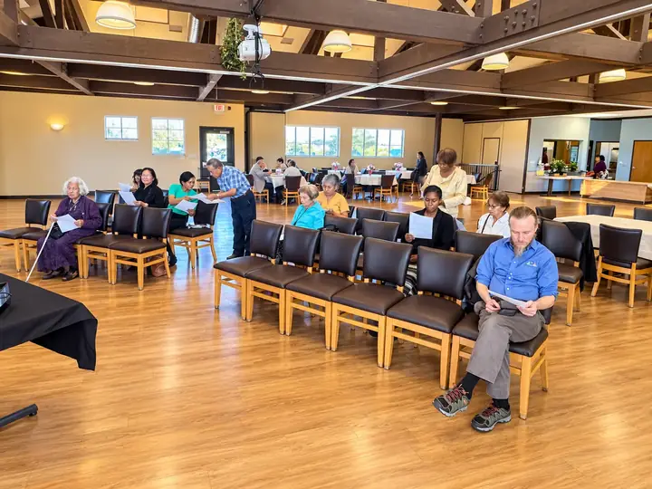 Seminar attendees seated at banquet tables