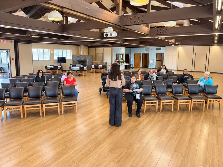 Fellowship hall arranged for a conference with rows of seating